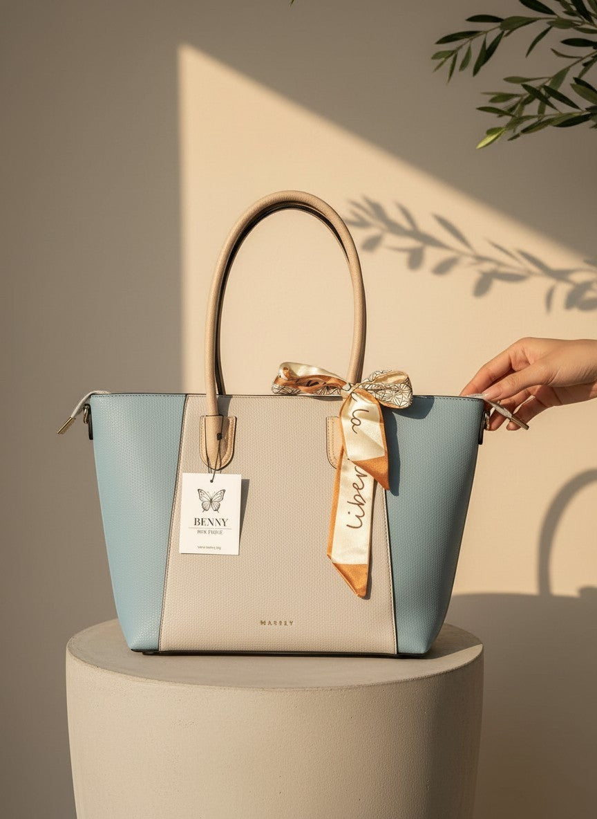 Пастелна трицветна шопър чанта от еко кожа на Benny Boutique с декоративен копринен шал върху постамент.